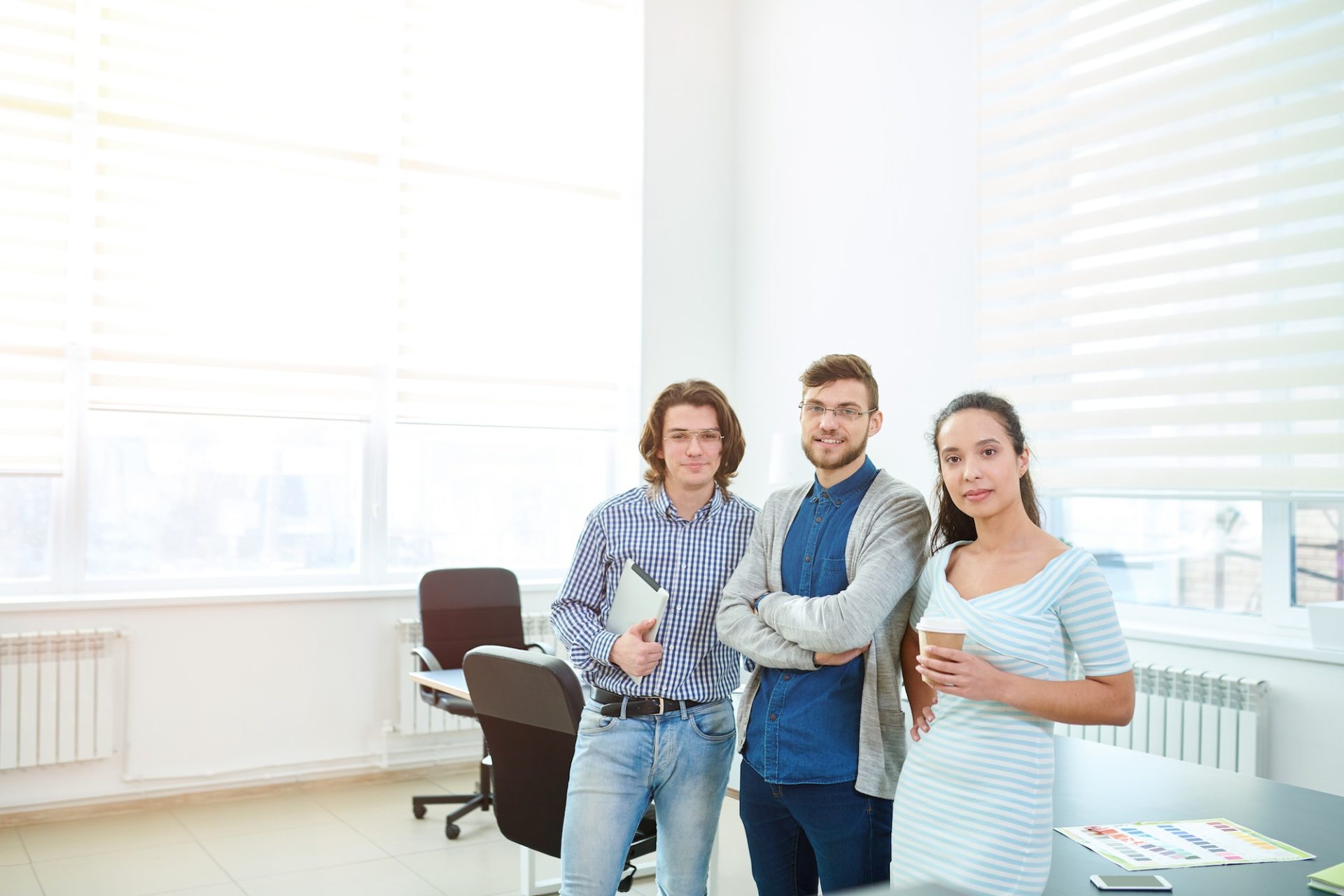 Ambitious young office employees in board room